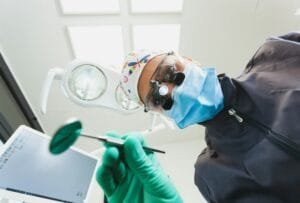 The patient's first person view at the examination by the dentist lies in the dental chair.